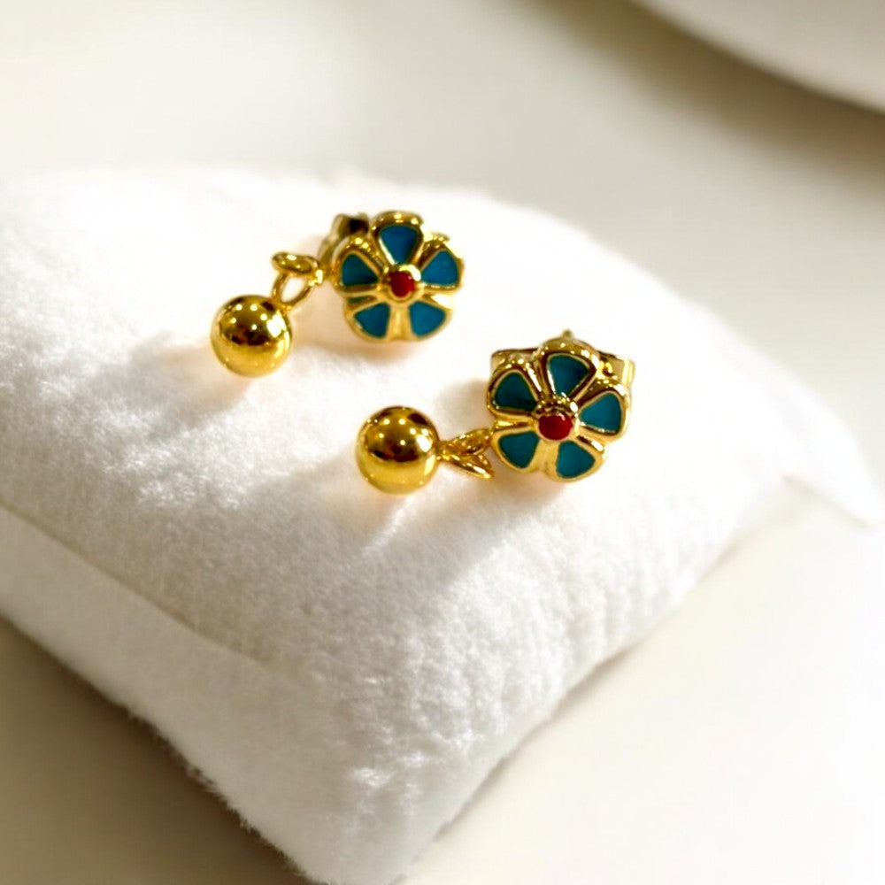 Delicate Sweet Flower Enamel Drop Earrings, available in 18K Gold Plated. Crafted from stainless steel, these earrings feature a charming floral design with a total size of 14.4mm x 6.2mm x 3mm and a total weight of 2g. Hypoallergenic, tarnish-free, water-resistant, and built for durability, these earrings offer effortless elegance. Delivered in a Sutra Designs custom jewelry packet for a premium experience