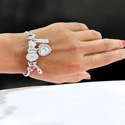 Elegant silver-plated heart-shaped bangle, crafted from durable stainless steel with an adjustable size of 5.5 cm, weighing 21g. Features hypoallergenic properties, tarnish-free finish, and exceptional durability for long-lasting wear. Delivered in Sutra Designs’ custom jewelry packaging, perfect for gifting or safekeeping