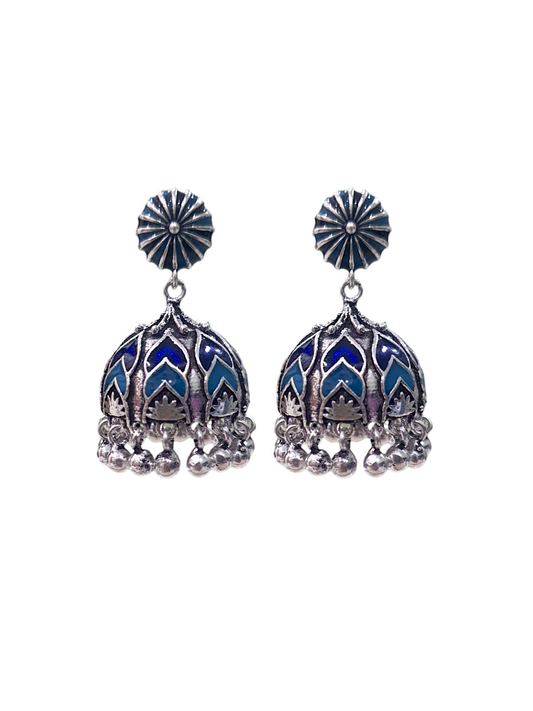 Beautiful Ela enamel jhumka earrings in antique silver, crafted from brass and enamel, designed to elevate your ethnic and festive look. Measuring 4 cm x 2 cm x 1 cm and weighing 28g, these skin-friendly earrings come in Sutra Designs’ custom jewelry packaging, perfect for traditional celebrations