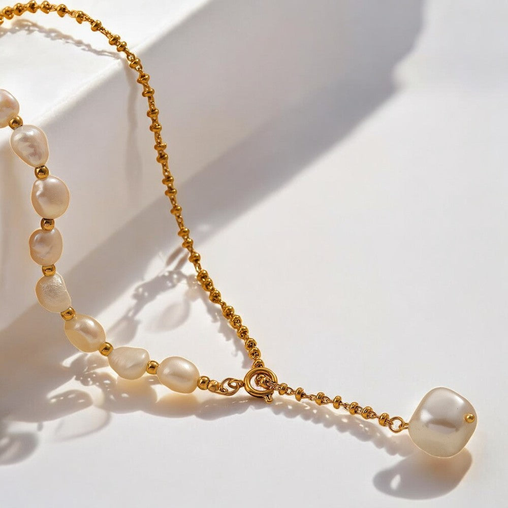 Freshwater Pearl Necklace, 18K Gold-Plated and crafted from titanium steel and pearls. Necklace length 52.5cm, with a total weight of 18g. Hypoallergenic, tarnish-free, water-resistant, and delivered in Sutra Designs' custom packaging