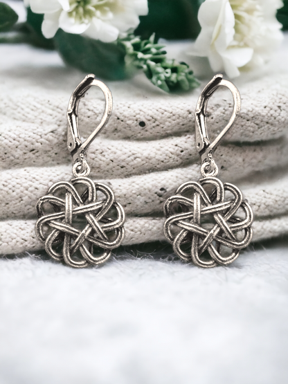 Krita Floral Charm Hoop Earrings in Antique Silver, crafted in brass with a 1.5cm charm size and a total weight of 4.1g. Skin-friendly material delivered in Sutra Designs' custom packaging