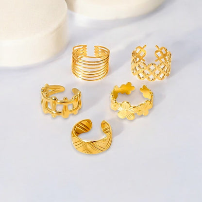 Set of 5 adjustable 18K Gold Plated rings crafted in stainless steel. Total weight 9.2g. These hypoallergenic, tarnish-free, and water-resistant rings offer exceptional durability and versatile styling. Perfect for stacking or wearing individually, they bring a sophisticated touch to your look. Delivered in Sutra Designs' custom jewelry packaging, ideal for gifting or elevating your own jewelry collection