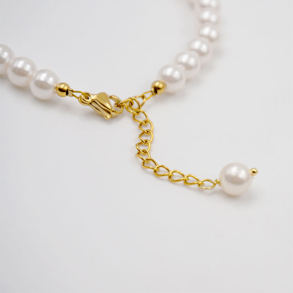 Elegant classical pearl and jade beaded handmade bracelet with gold-plated stainless steel accents. Adjustable size of 17 cm + 4 cm, weighing 10g. Hypoallergenic, tarnish-free, and designed for exceptional durability, this bracelet arrives in Sutra Designs’ custom jewelry packaging